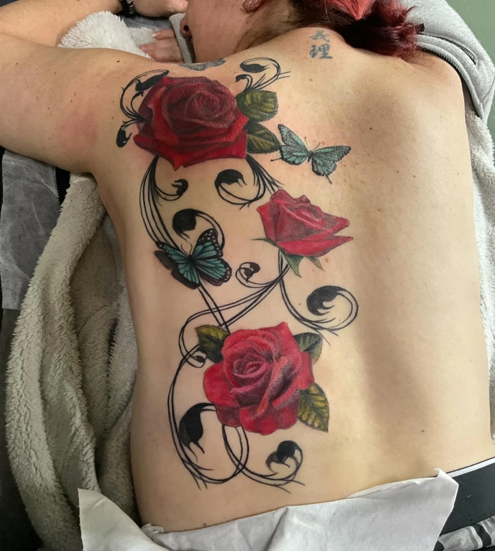 Red roses back piece with butterflies and swirling vines